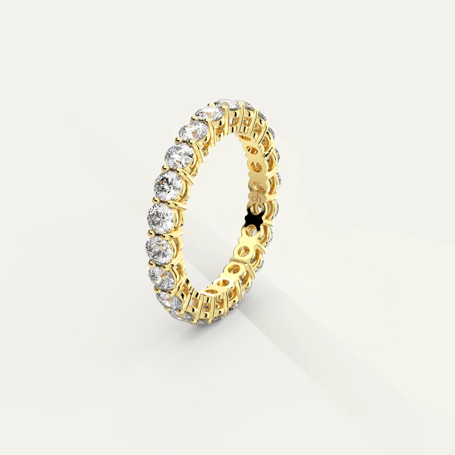 Goldmacher Ethereal 18k Gold Eternity Ring – Ethical Diamond-Alternative 2.2ct Round Moissanite for Sustainable Luxury and Daily Sparkle.