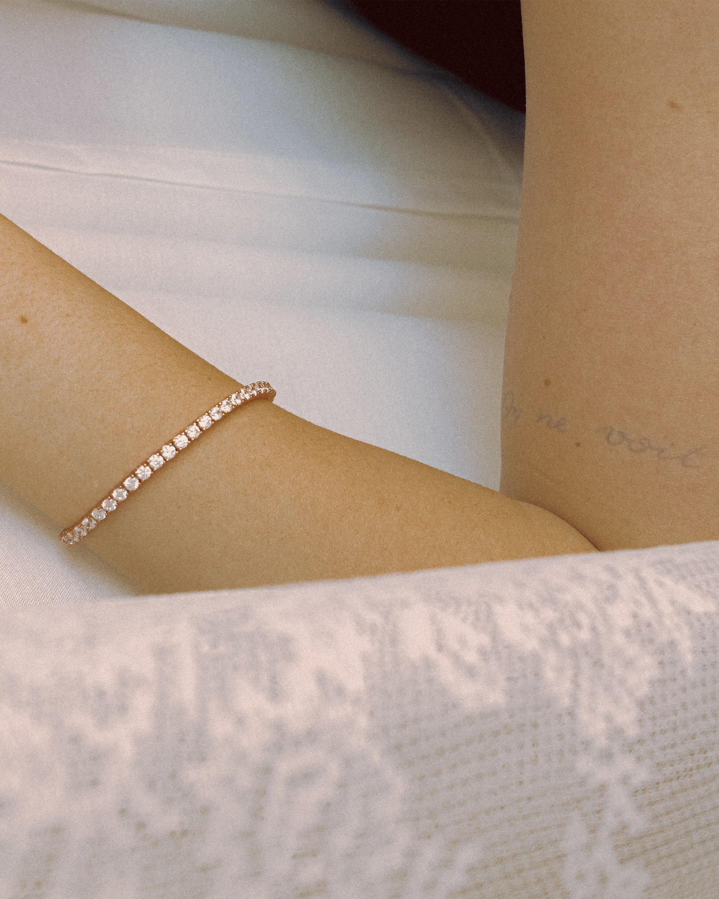 Styling shot of Goldmacher’s Linea bracelet on model – sleek zircon row with delicate shine
