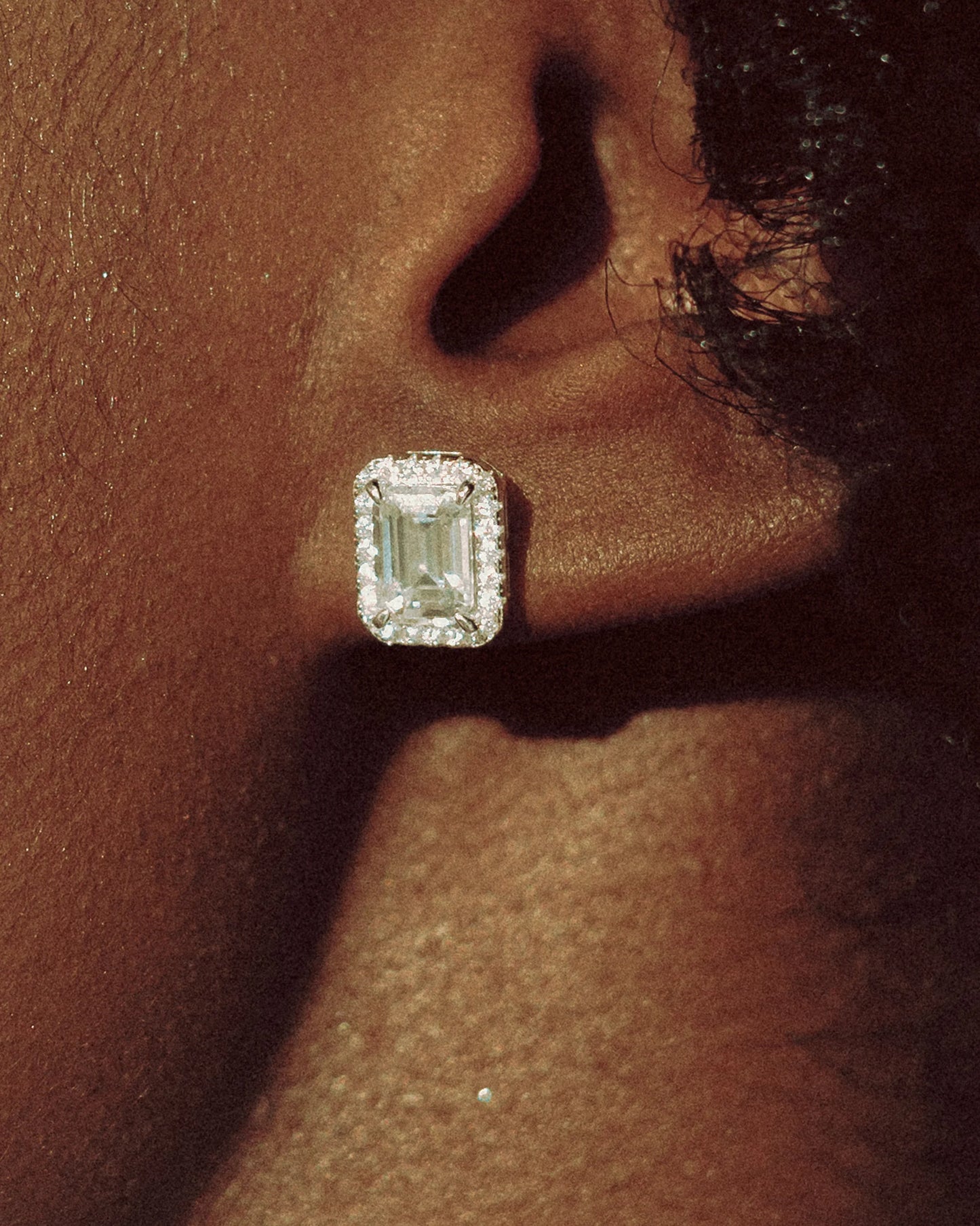 Elegantly layered look with a Goldmacher moissanite halo stud earrings
