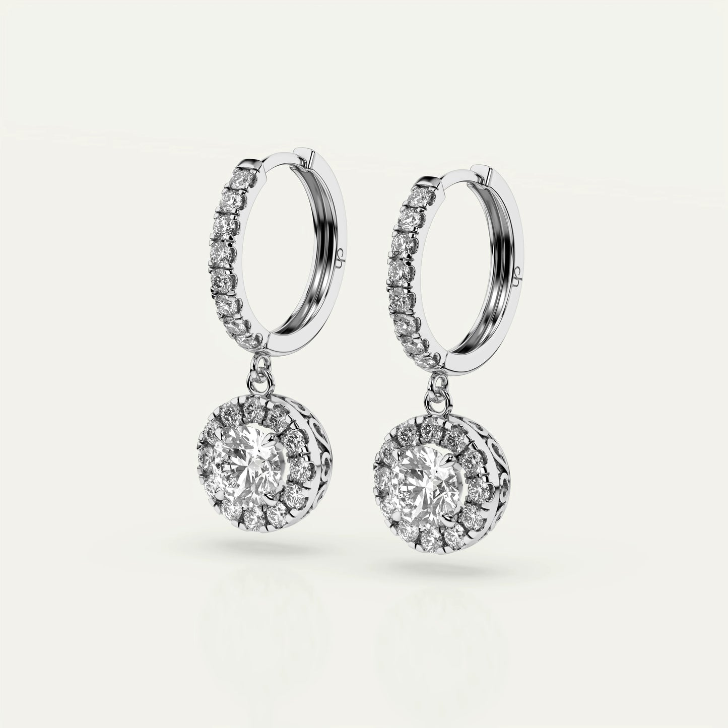 Goldmacher Pollux luxury earrings featuring 1 carat round-cut moissanite gemstone, halo accent, and polished 925 silver finish.