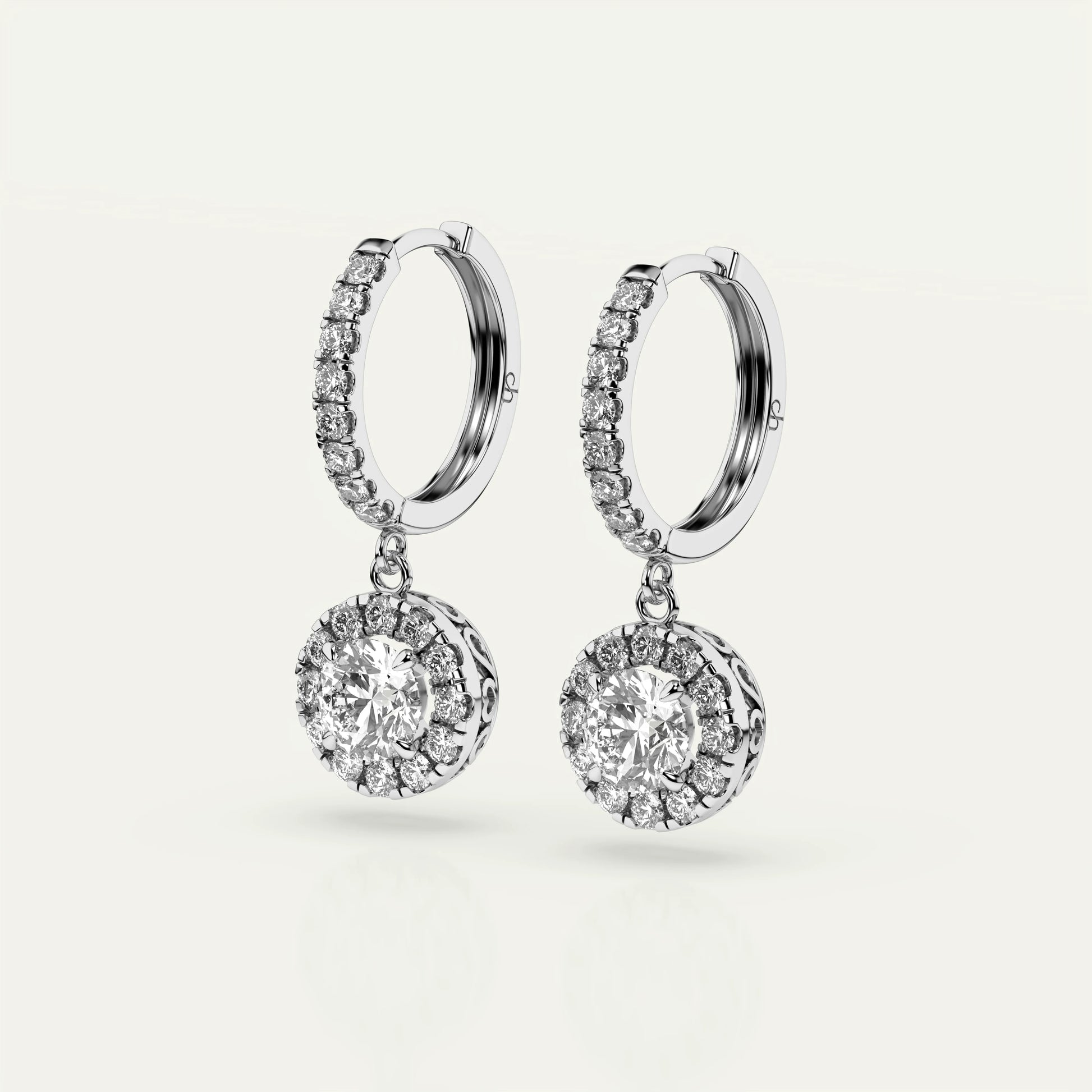Goldmacher Pollux luxury earrings featuring 1 carat round-cut moissanite gemstone, halo accent, and polished 925 silver finish.