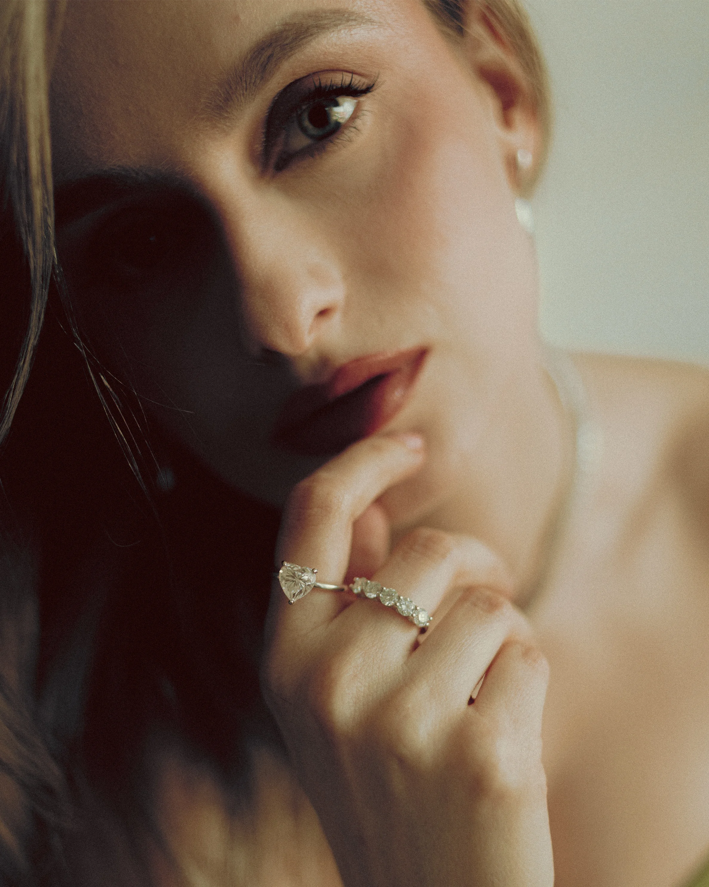 Close-up of Rigel, Elora 1CT, moissanite rings by Goldmacher styled