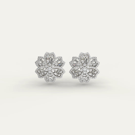 Goldmacher Rosemary floral moissanite cluster earrings in 925 silver with mixed round and baguette cuts.