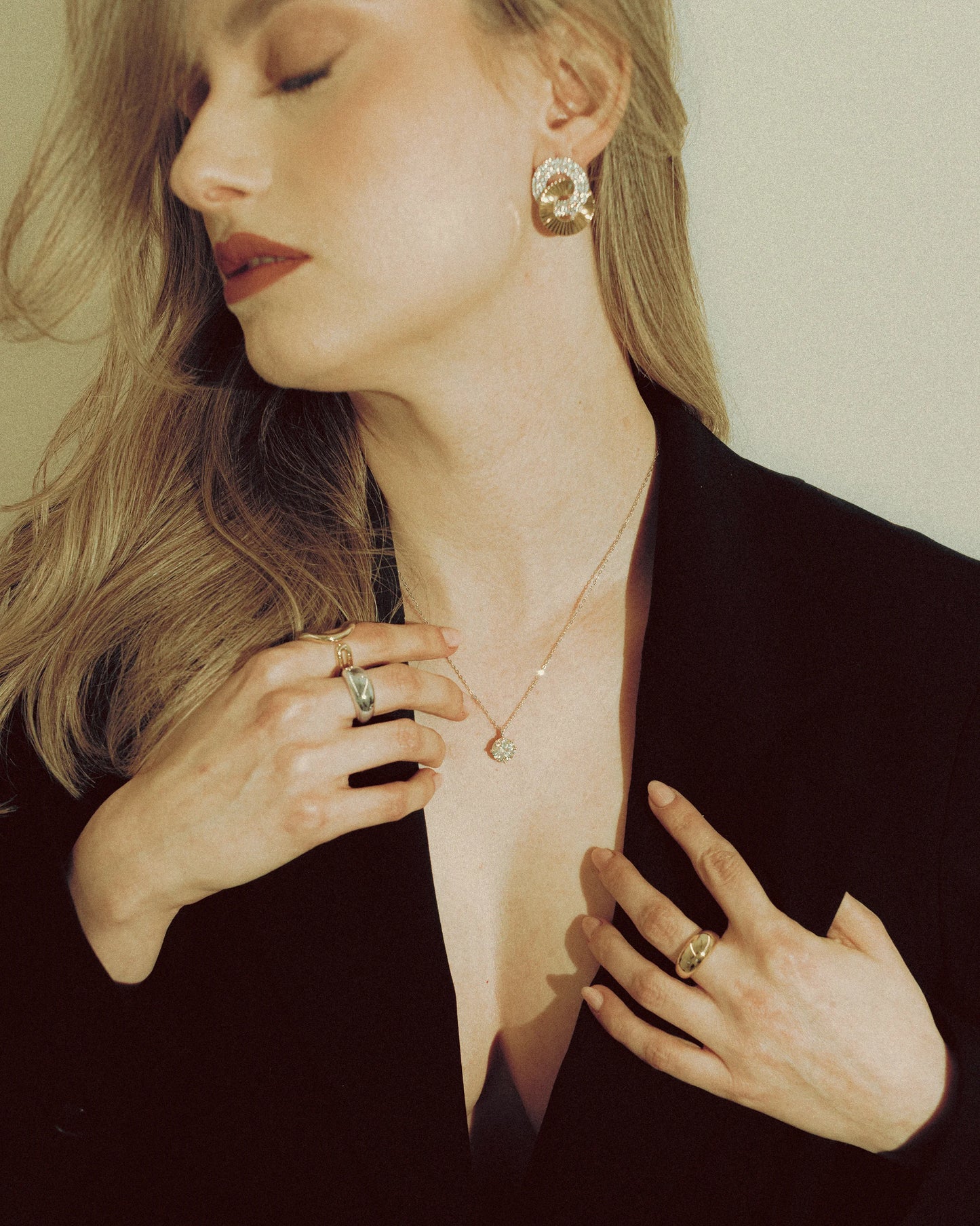 Model showcases Goldmacher Zenith necklace featuring a 3CT moissanite solitaire pendant in a timeless design