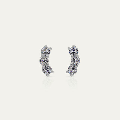 Goldmacher Orio earrings in 925 silver with multiple round moissanite stones in a curved ear climber design