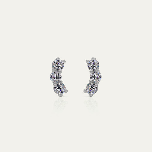 Goldmacher Orio earrings in 925 silver with multiple round moissanite stones in a curved ear climber design