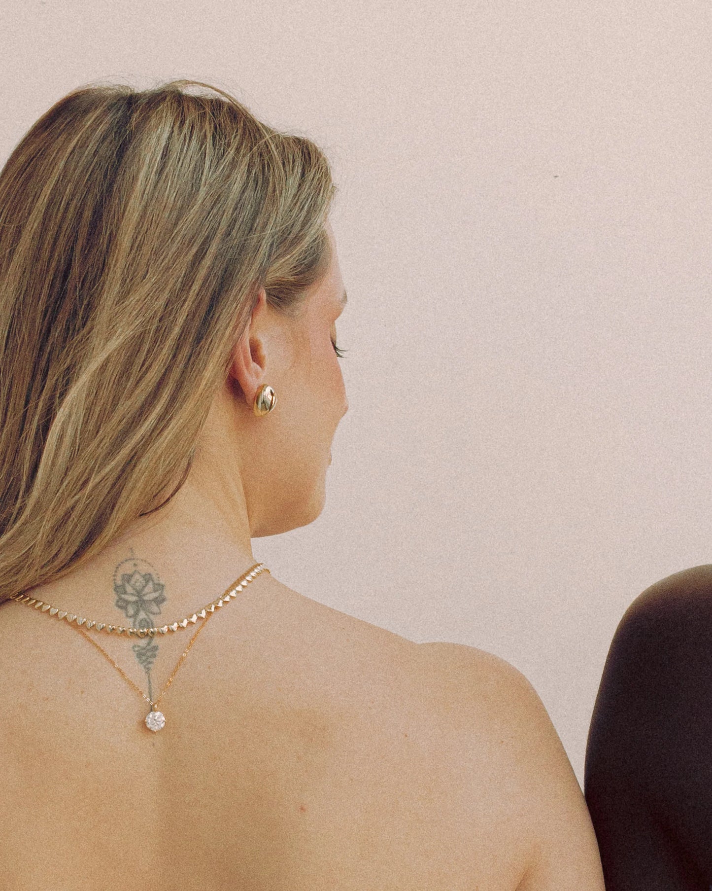 Puffy Heart Earrings by Goldmacher – Polished heart-shaped earrings styled on ear for a playful, modern look