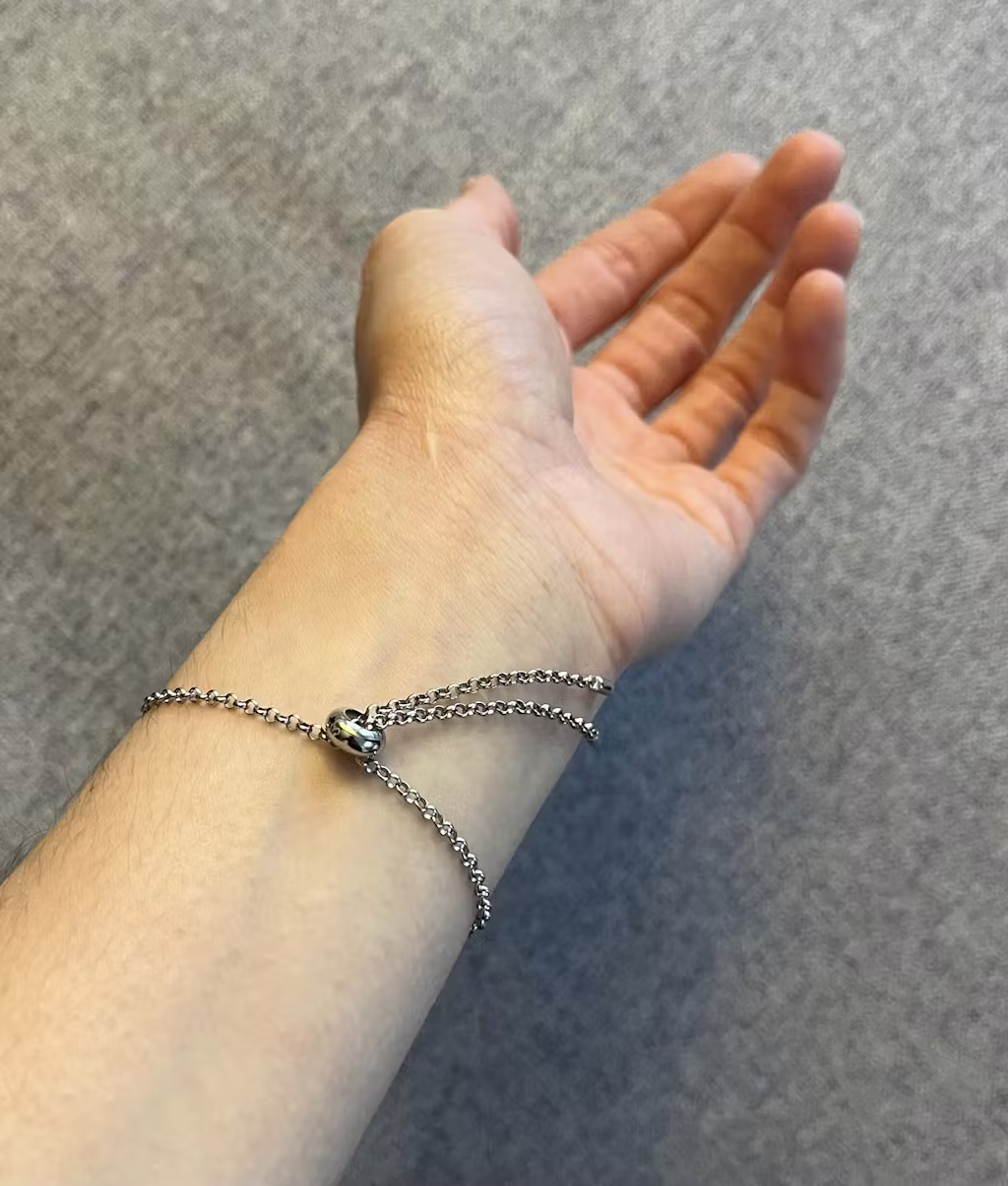 Customer showcasing Goldmacher Lyric bracelet on wrist