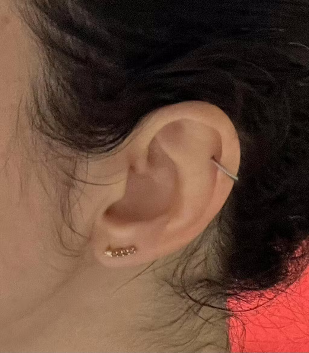 Customer wearing Goldmacher Mocha stud earrings